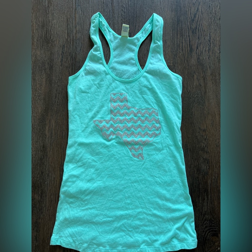 Size small & medium Kavio! T back tanks with Texas and chevron design teal.
